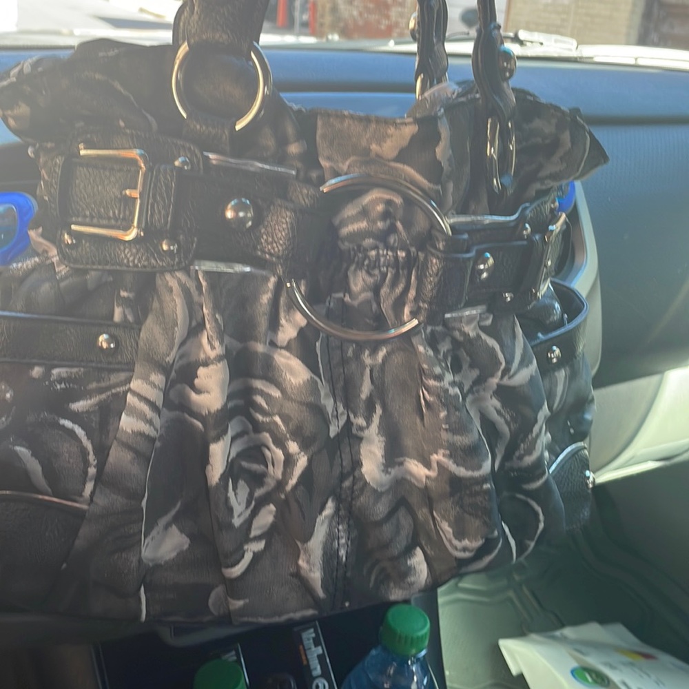 black and silver leather purse made by Wilson leather